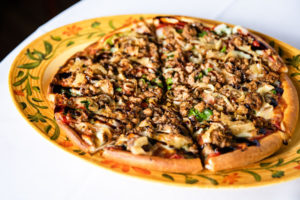 thin crust pizza with sausage at Mario Fazio's